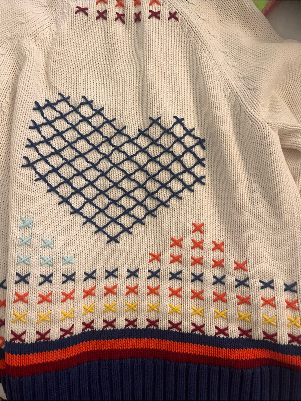 Cream Knit Sweater with Navy Heart and Multicolor Cross-Stitch Details
